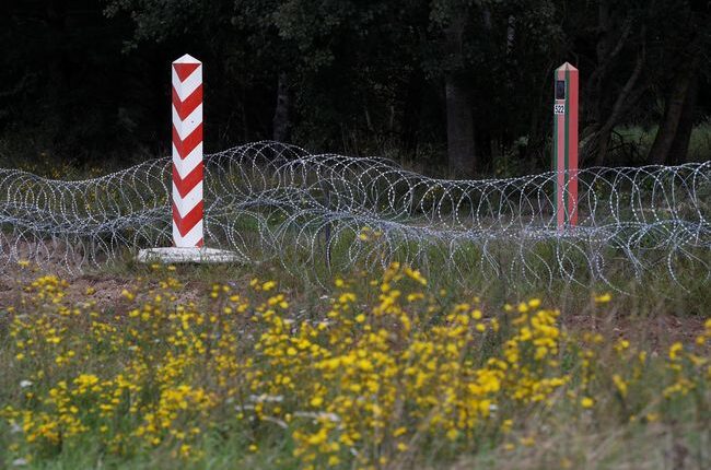 Border signs are pictured at the Polish-Belarusian border near the village of Usnarz Gorny